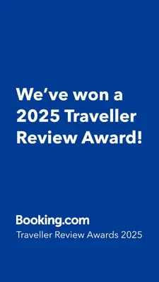 a blue sign that says weve won a traveler review award at Wellness Oase med Sauna, Fodbad og Højhastighed Internet i Naturens Fred og Ro in Nibe