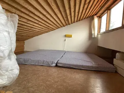 a bed in a room with a wooden ceiling at 6 person holiday home in Bedsted Thy-By Traum in Bedsted Thy