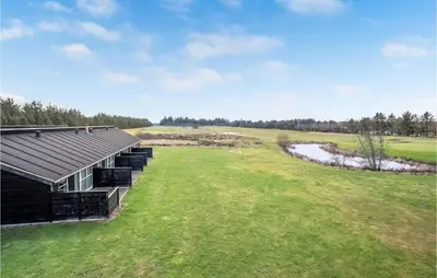 an overhead view of a building on a golf course at 2 Bedroom Nice Home In Pandrup in Pandrup