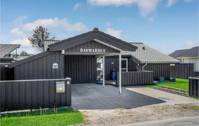 a building with a sign that reads backyards at Nice Home In Blokhus With Kitchen in Blokhus