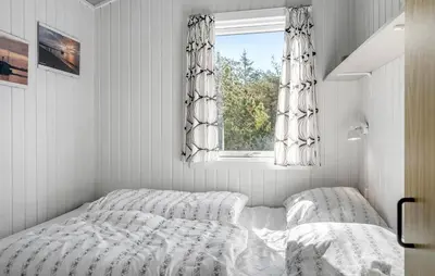 a bedroom with a bed and a window at Beautiful Home In Thisted With Kitchen in Thisted
