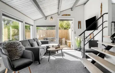 a living room with a couch and a table at Beautiful Home In Thisted With Kitchen in Thisted