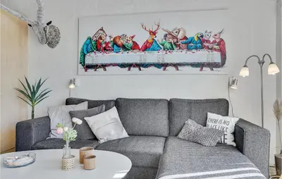 a living room with a gray couch and a table at Amazing Home In Vestervig With Sauna in Vestervig