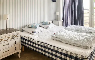 a bedroom with two beds and a dresser and a window at Lovely Home In Spøttrup With Wifi in Spottrup
