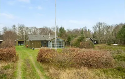 a house in the middle of a field at Beautiful Home In Thyholm With Wifi in Thyholm