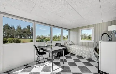 a living room with a table and chairs and windows at Stunning Home In Vemb With Wifi in Vemb