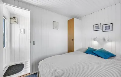 a white bedroom with a bed with a blue pillow at Stunning Home In Vemb With Wifi in Vemb