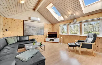 a living room with a couch and a tv at Stunning Home In Vemb With Wifi in Vemb