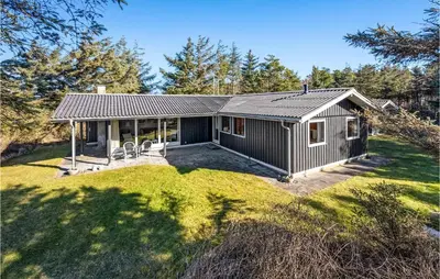 an exterior view of a house with a yard at 3 Bedroom Gorgeous Home In Thyholm in Thyholm