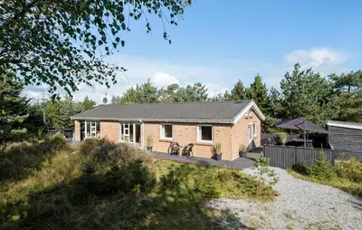 a brick house with two bikes parked outside of it at Cozy Home In Fjerritslev With Wifi in Fjerritslev