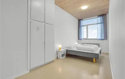 a white room with a bed and a window at Stunning Home In Hanstholm With Sauna in Hanstholm