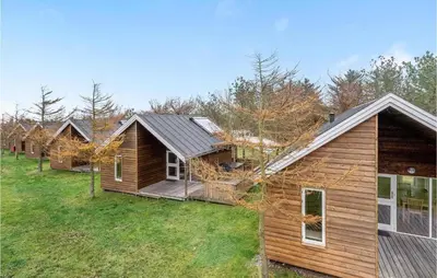 a row of log homes in a row at Stunning Home In Hanstholm With Wifi in Hanstholm