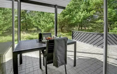 a table with a towel on it on a patio at Stunning Home In Fjerritslev With Sauna in Fjerritslev