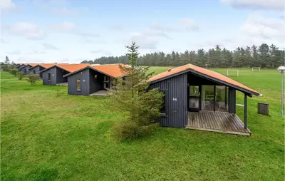 an aerial view of a row of houses in a field at Cozy Home In Hanstholm With Kitchen in Hanstholm