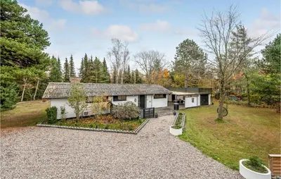 an exterior view of a house with a yard at Lovely Home In Højslev With Wifi in Højslev