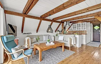 a living room with a table and chairs at Beautiful Home In Løgstrup With Wifi in Løgstrup