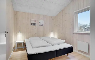 a bedroom with a bed in a room with a window at Amazing Home In Farsø With Wifi in Farsø