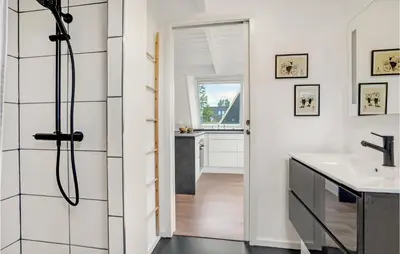a bathroom with a shower and a sink at 2 Bedroom Cozy Home In Farsø in Farsø