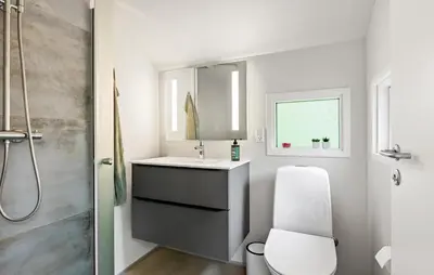 a bathroom with a toilet and a sink and a shower at 3 Bedroom Cozy Home In Nibe in Nibe