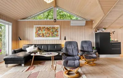 a living room with a couch and two chairs at 3 Bedroom Cozy Home In Nibe in Nibe