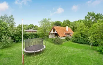 a backyard with a gazebo in the grass at Nice Home In Løgstrup With Wifi in Løgstrup