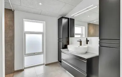 a bathroom with a sink and a mirror at Cozy Home In Farsø With Wifi in Farsø