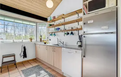a kitchen with a stainless steel refrigerator at Awesome Home In Lemvig With Kitchen in Lemvig