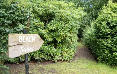 a sign that says beach this way in front of a bush at Pet Friendly Home In Roslev With Wifi in Roslev