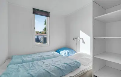 a bedroom with a bed and a window at Lovely Home In Vestervig With Kitchen in Vestervig