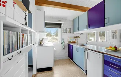 a kitchen with white and purple cabinets and a sink at 2 Bedroom Beautiful Home In Thisted in Thisted