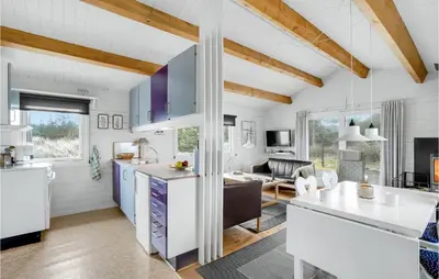 a kitchen and living room with white walls and wooden ceilings at 2 Bedroom Beautiful Home In Thisted in Thisted