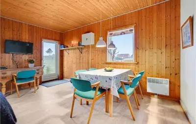 a dining room with a table and chairs at Gorgeous Home In Harboøre With Wifi in Harboør