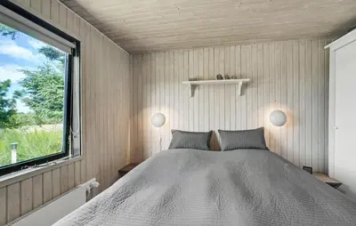 a bedroom with a bed and a window at Beautiful Home In Spøttrup With Kitchen in Spottrup