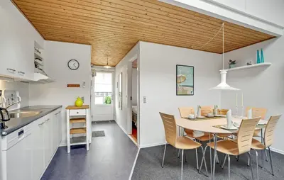 a kitchen and dining room with a table and chairs at Awesome Apartment In Vestervig in Vestervig