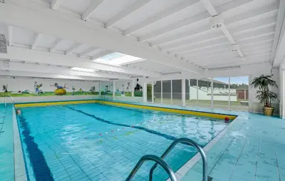 a large indoor swimming pool with a large pool at Awesome Apartment In Vestervig in Vestervig