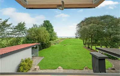 a view of the yard from the porch of a house at 1 Bedroom Beautiful Home In Roslev in Roslev