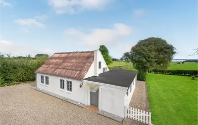 a small white chapel with a red roof at 1 Bedroom Beautiful Home In Roslev in Roslev