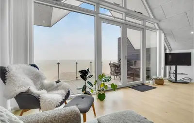 a living room with a couch and chairs and windows at Stunning Apartment In Thisted With Wifi in Thisted