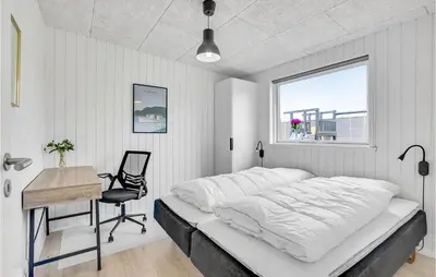 a bedroom with a bed and a desk and a window at Gorgeous Home In Løgstrup With Kitchen in Løgstrup