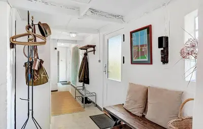 a living room with a bench and white walls at Amazing Home In Nykøbing M With Wifi in Tæbring