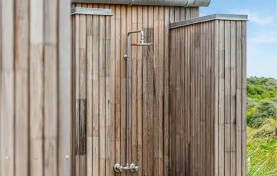 a wooden building with a shower in front of it at 3 Bedroom Lovely Home In Fjerritslev in Fjerritslev