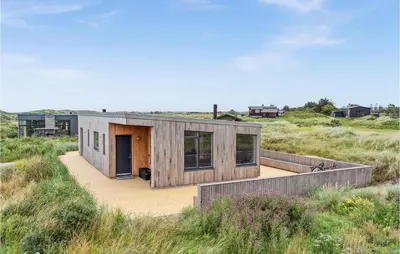a small wooden house in the middle of a field at 3 Bedroom Lovely Home In Fjerritslev in Fjerritslev
