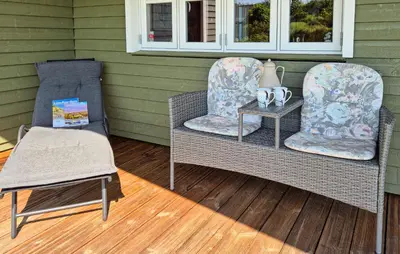two chairs and a table on a porch at Stunning Home In Hurup Thy With Wifi in Doverodde
