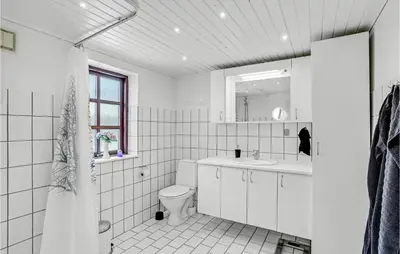 a white bathroom with a toilet and a sink at Lovely Home In Hurup Thy With Wifi in Gettrup