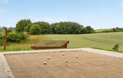 a bunch of balls are sitting on the ground at Cozy Home In Spøttrup With Wifi in Spottrup