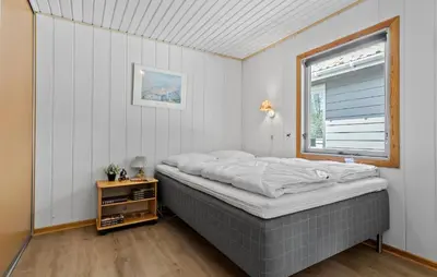 a bedroom with a bed and a window at Amazing Home In Farsø With Wifi in Farsø