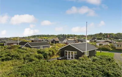 a house on a hill in a suburb at Lovely Home In Løgstør With Kitchen in Løgstør