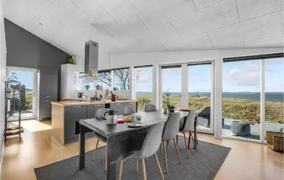 a kitchen and dining room with a table and chairs at Stunning Home In Højslev With Kitchen in Højslev