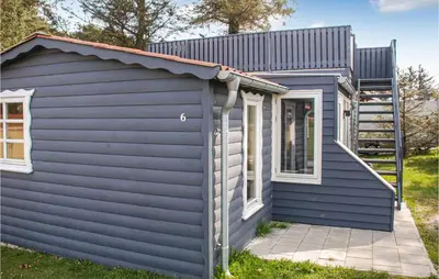 a blue house with a metal roof at Stunning Home In Hanstholm in Hanstholm