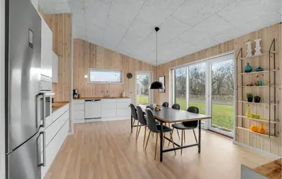 a kitchen and dining room with a table and chairs at Beautiful Home In Løgstrup With Kitchen in Løgstrup